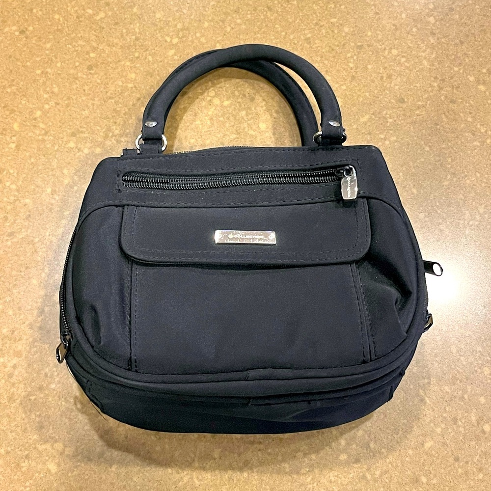 Lovely Collection multi pocket handbag. Perfect for everyday and night life.